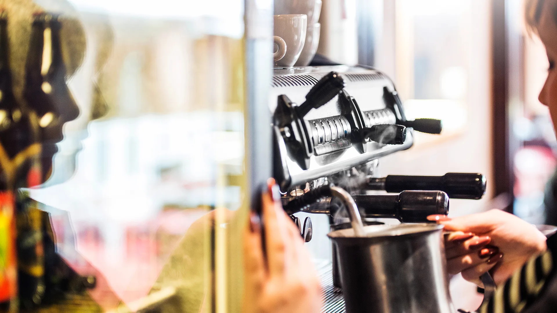 Frothing milk for coffees in The Burgundy Bar. 