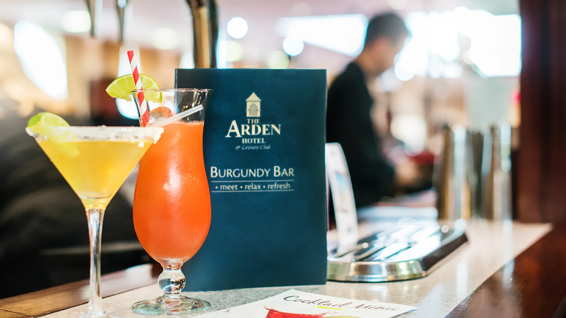 Vibrant cocktails and the menu of The Burgundy Bar.